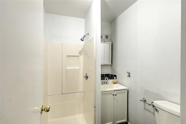 full bathroom featuring vanity, toilet, and walk in shower