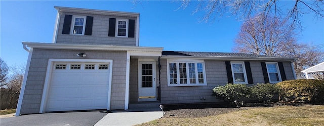 view of front of home with a garage and driveway