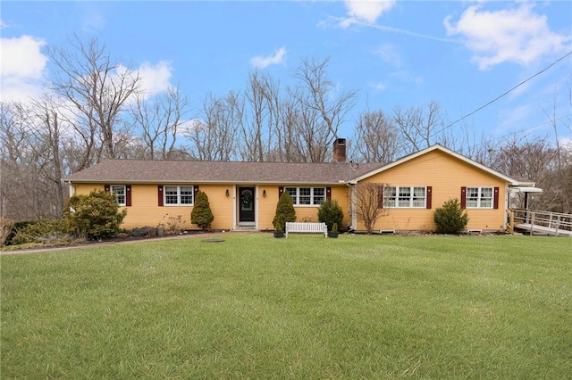 ranch-style house featuring a front lawn and a chimney