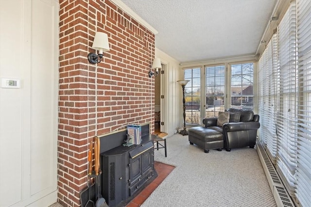 sunroom / solarium with a wood stove and visible vents