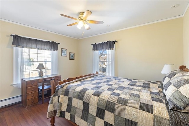 bedroom featuring a baseboard radiator, multiple windows, crown molding, and wood finished floors