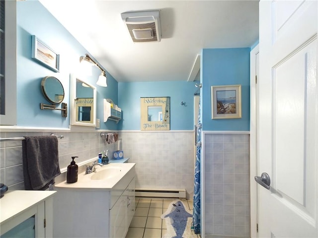 bathroom with a shower with shower curtain, a baseboard radiator, tile walls, and tile patterned floors