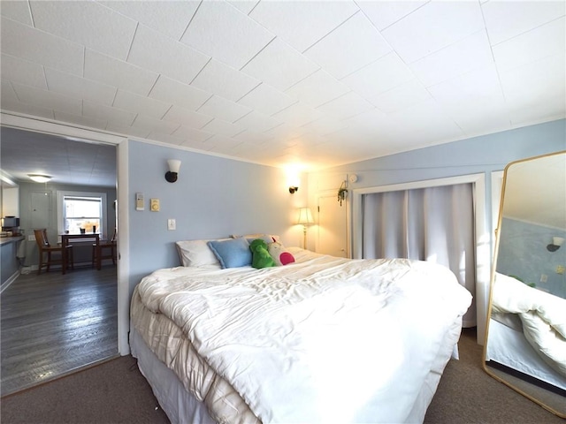 bedroom with wood finished floors