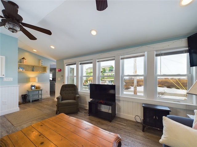 living area featuring a wainscoted wall, recessed lighting, a ceiling fan, vaulted ceiling, and wood finished floors