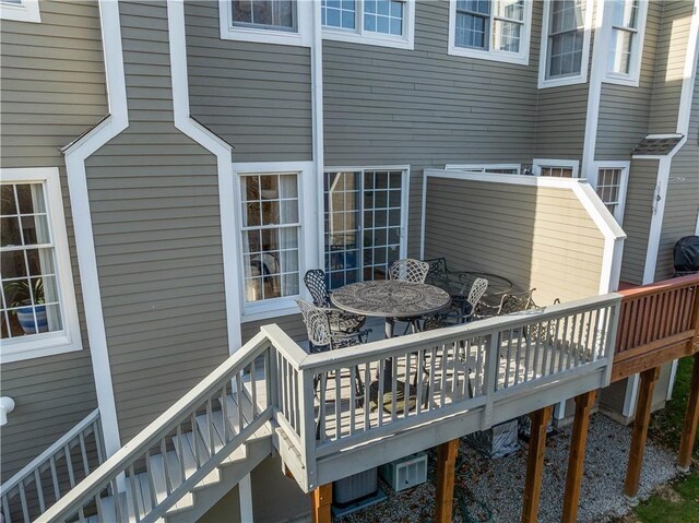 wooden terrace featuring outdoor dining area