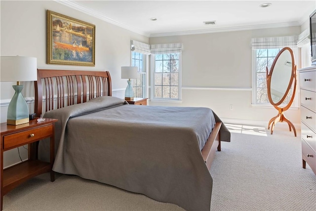 bedroom featuring visible vents, multiple windows, ornamental molding, and carpet flooring