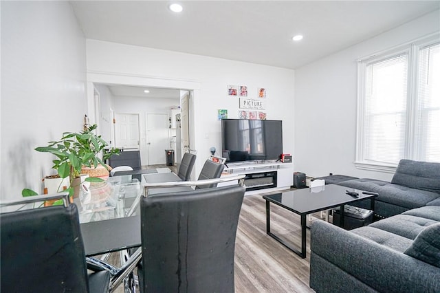 living room featuring wood finished floors, a wealth of natural light, and recessed lighting