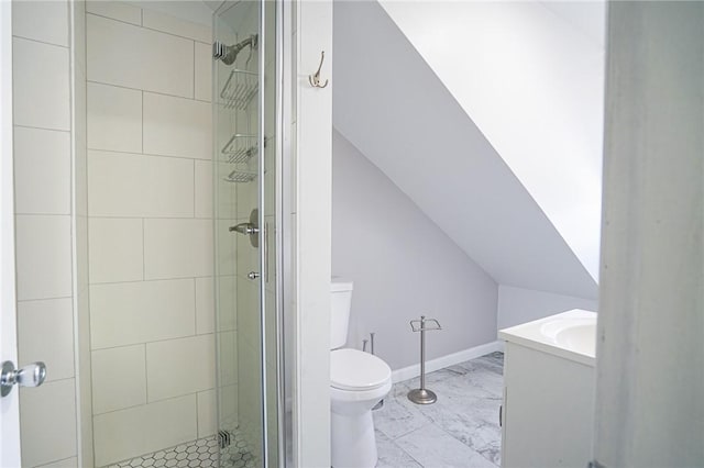 bathroom with toilet, baseboards, vaulted ceiling, marble finish floor, and a stall shower