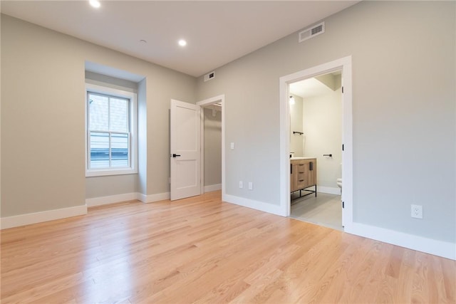 unfurnished bedroom featuring baseboards, recessed lighting, visible vents, and light wood-style floors