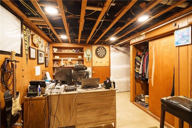 office with wooden walls and tile patterned floors