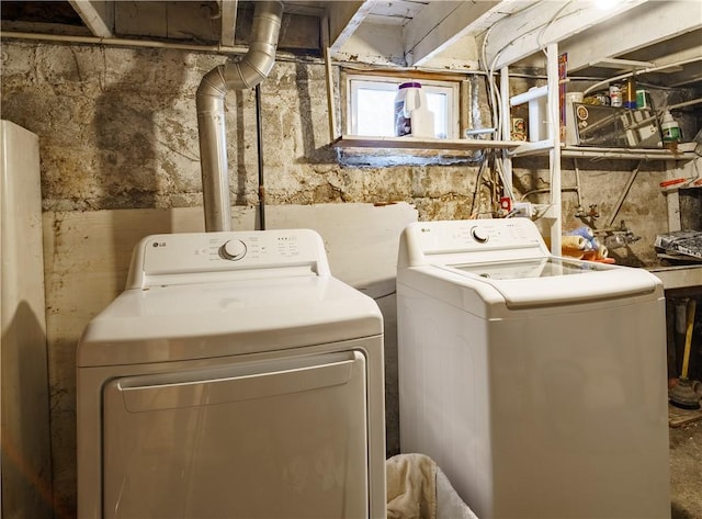 laundry area with laundry area and separate washer and dryer