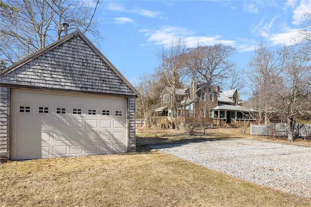 exterior space with an outbuilding, a porch, and a garage