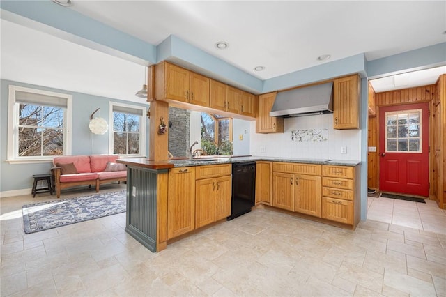 kitchen featuring tasteful backsplash, a wealth of natural light, black dishwasher, and wall chimney range hood