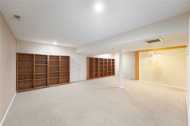 finished below grade area with carpet flooring, visible vents, and baseboards