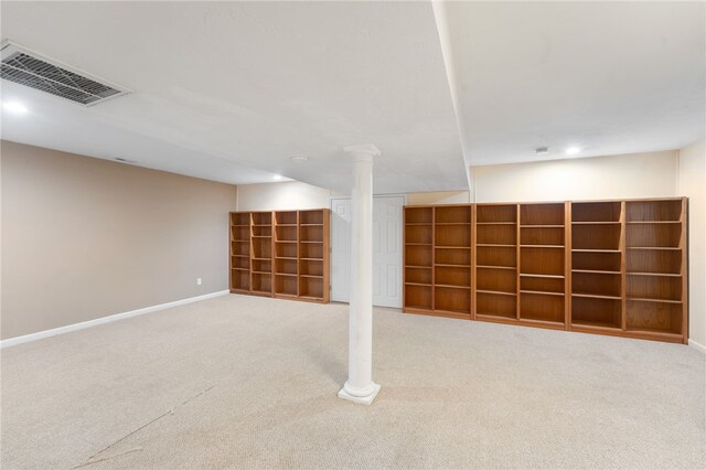 finished basement featuring carpet, visible vents, and baseboards