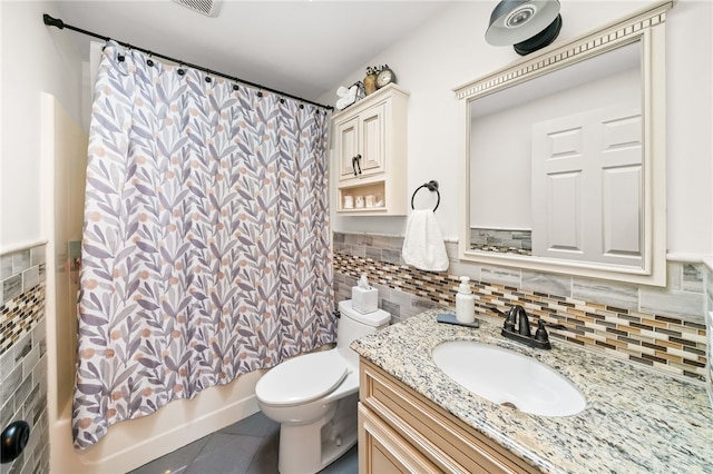 full bathroom featuring shower / bath combo, toilet, tile patterned flooring, vanity, and tile walls