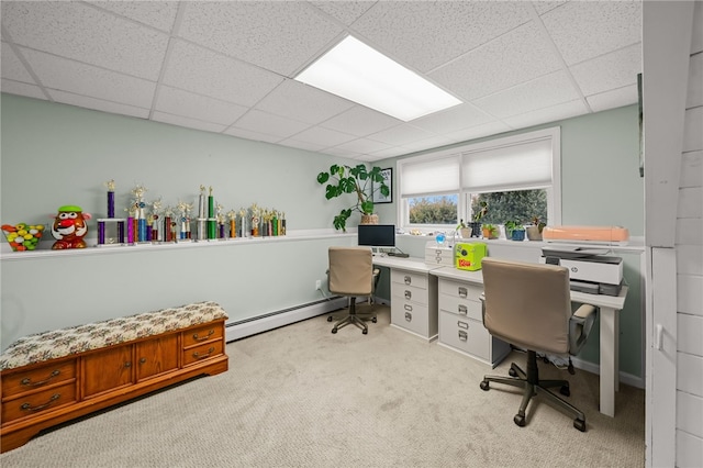 carpeted home office featuring a baseboard heating unit and a drop ceiling