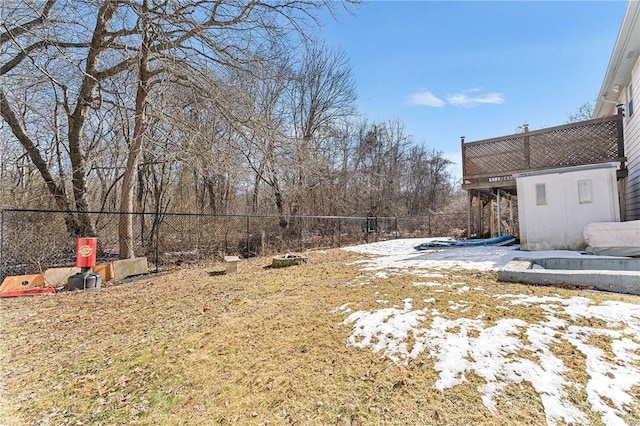 snowy yard with fence