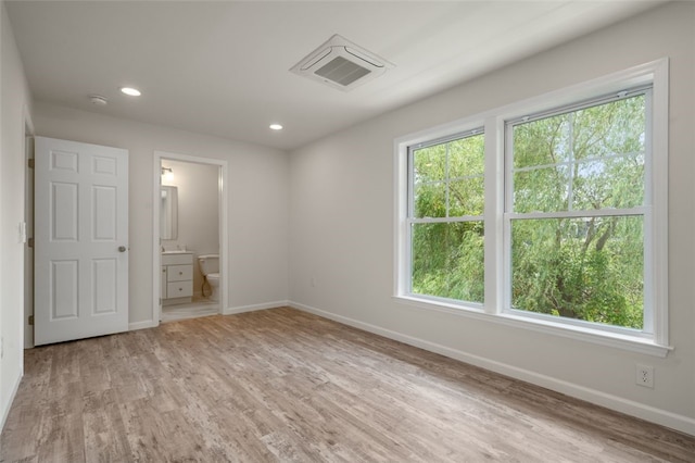 unfurnished bedroom with light wood finished floors, visible vents, recessed lighting, and baseboards