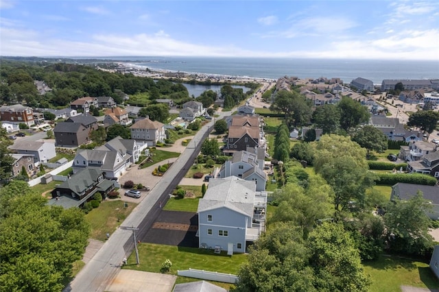 drone / aerial view featuring a residential view and a water view