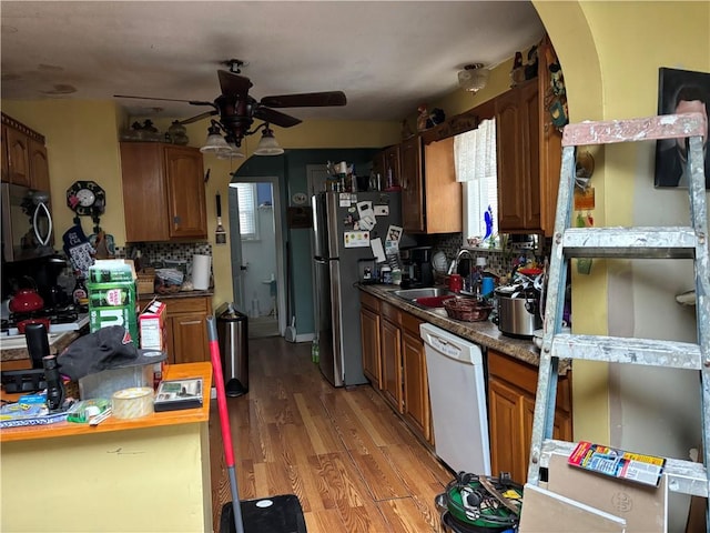73 Eton Ave, Warwick, RI 02889 - kitchen with dishwasher, a ceiling fan, freestanding refrigerator, and decorative backsplash