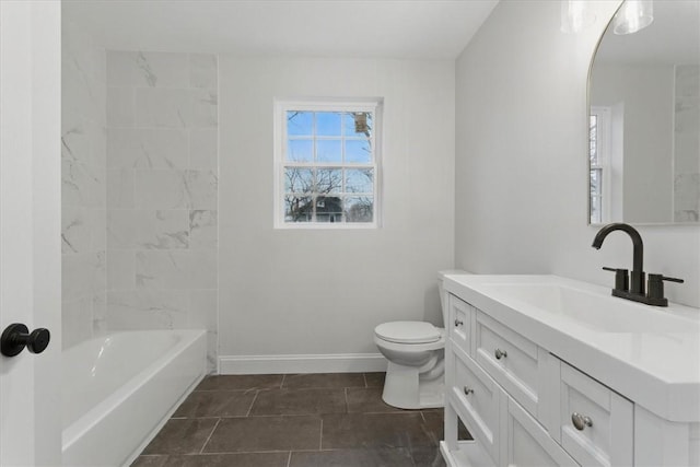 full bath featuring vanity, toilet, and baseboards