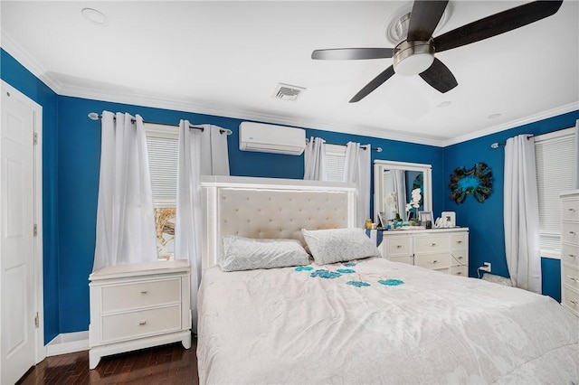 bedroom with visible vents, a ceiling fan, ornamental molding, wood finished floors, and a wall mounted air conditioner