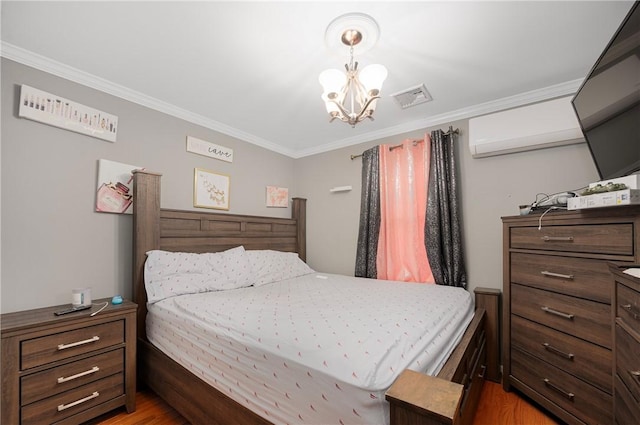 bedroom with ornamental molding, visible vents, an inviting chandelier, and a wall mounted AC