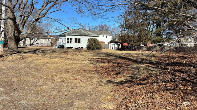 view of property exterior featuring a storage unit and an outbuilding