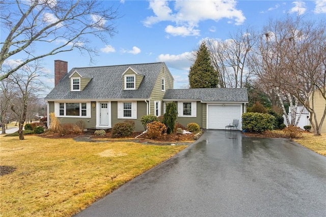 cape cod house with a garage, a chimney, a front lawn, and aphalt driveway