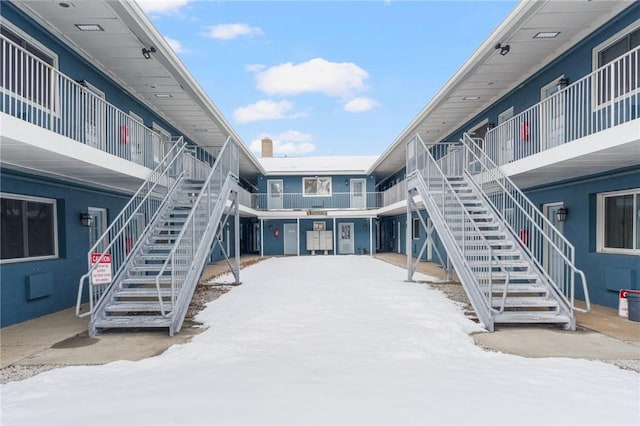 view of property's community featuring stairway