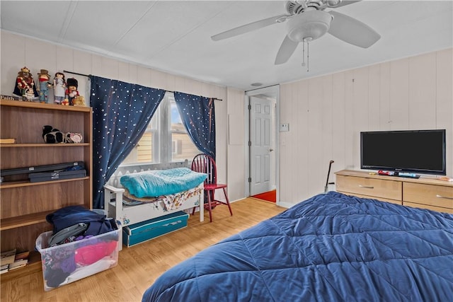 bedroom featuring a ceiling fan and wood finished floors