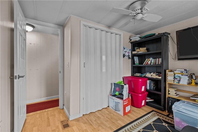 interior space featuring visible vents and ceiling fan