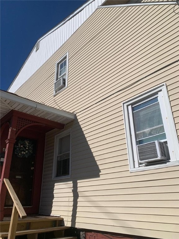 view of property exterior with cooling unit