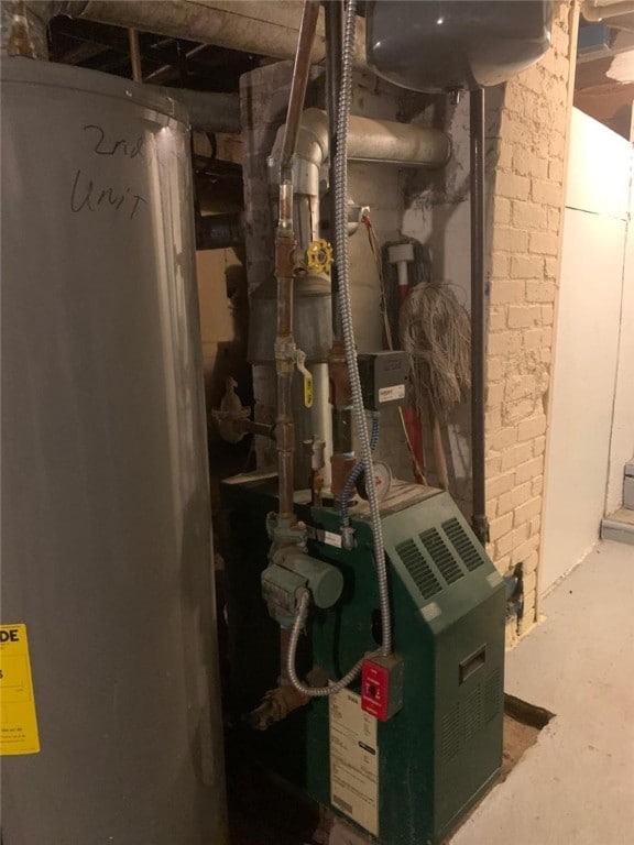 utility room featuring gas water heater