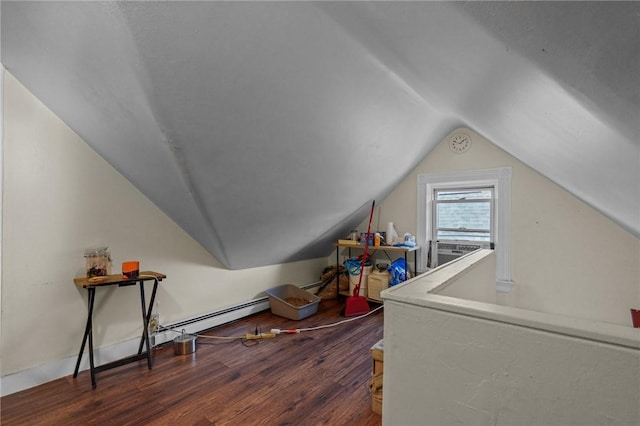 bonus room with vaulted ceiling, a baseboard radiator, and wood finished floors