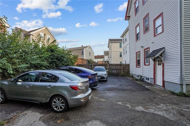 view of car parking with fence