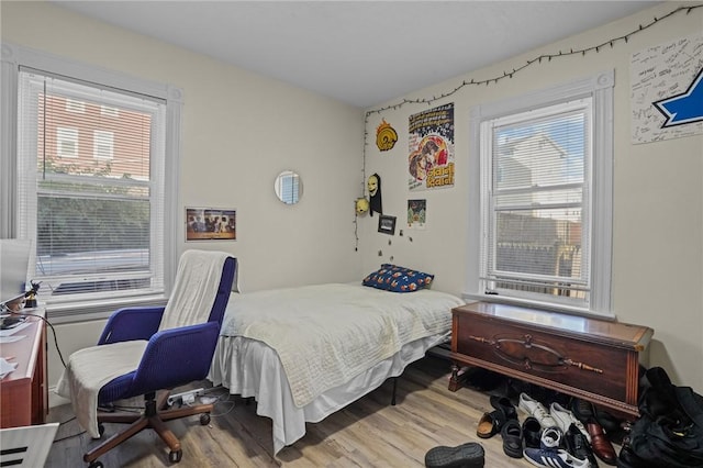 bedroom with wood finished floors