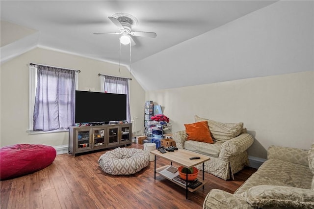 living room featuring lofted ceiling, ceiling fan, and wood finished floors