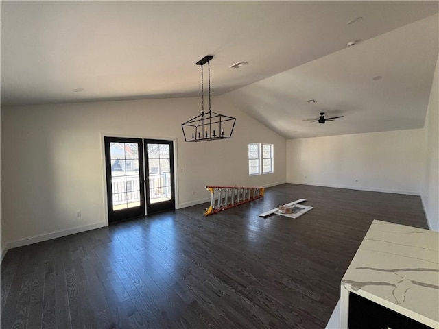 interior space featuring lofted ceiling, visible vents, baseboards, french doors, and dark wood-style floors