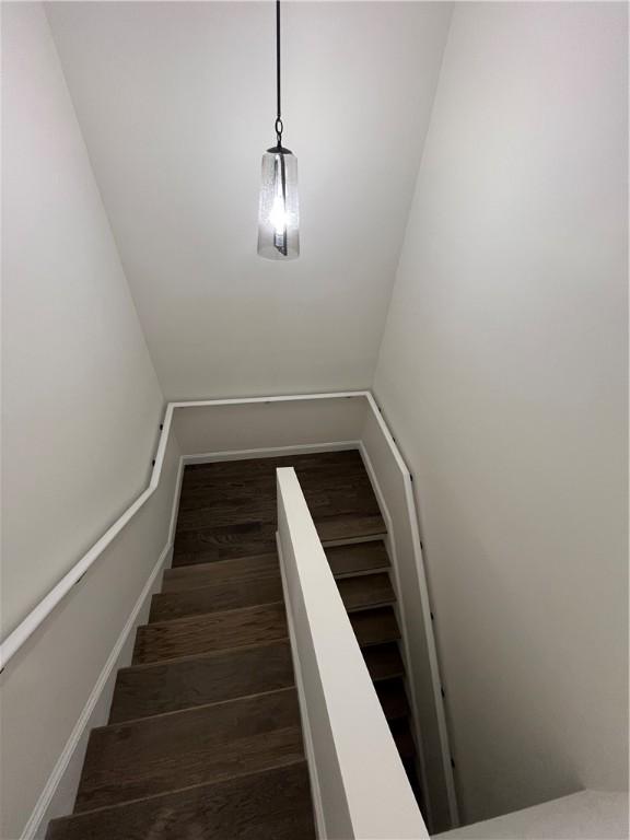 staircase featuring wood finished floors