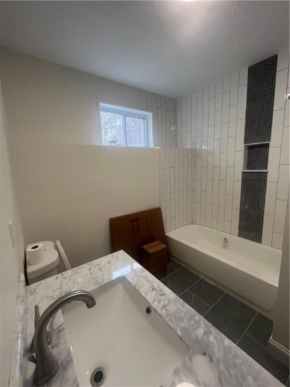 bathroom featuring a sink and tile patterned floors