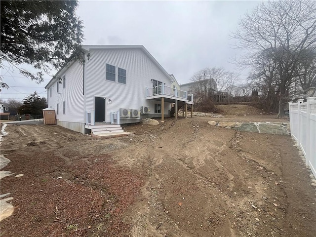 back of house featuring fence