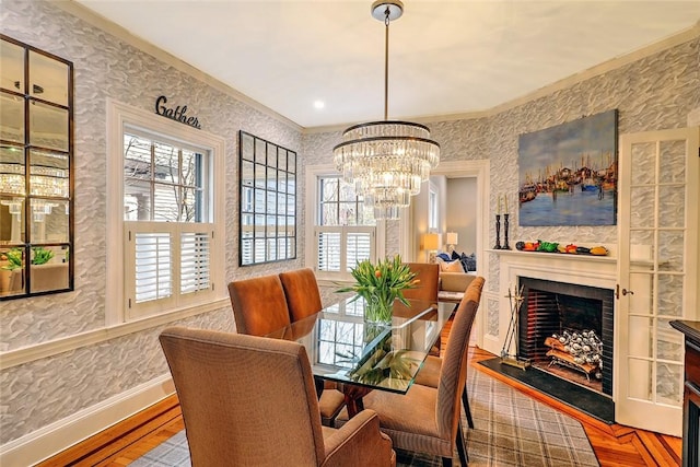 dining room with wallpapered walls, a fireplace, and a wealth of natural light