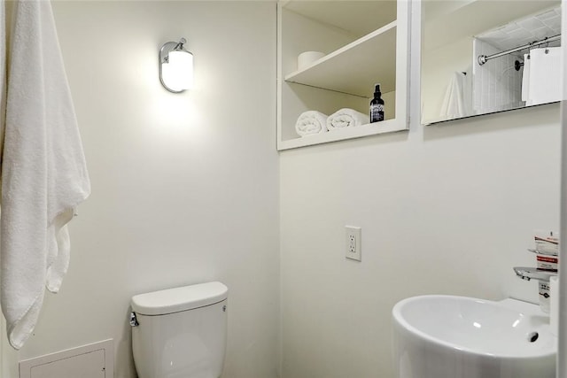 bathroom featuring a sink and toilet