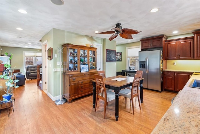 dining space with ceiling fan, baseboards, light wood-style flooring, and recessed lighting