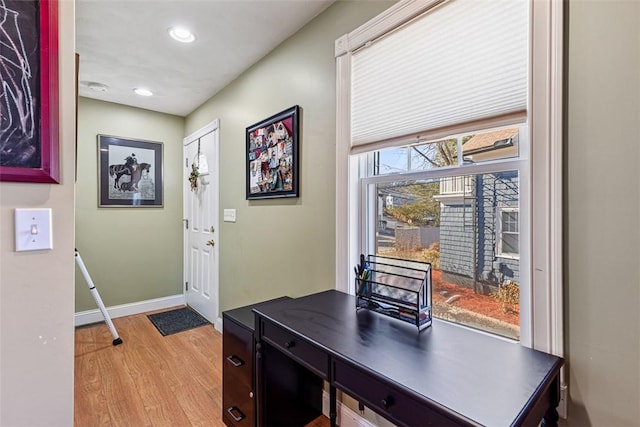 interior space featuring recessed lighting, light wood-style flooring, and baseboards