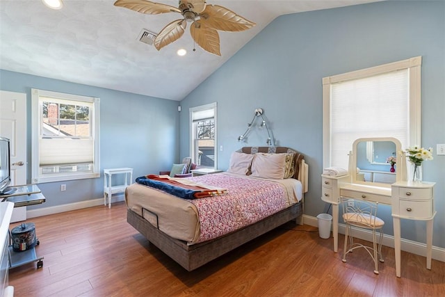 bedroom featuring multiple windows, wood finished floors, and visible vents