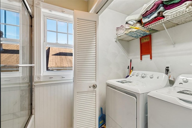 laundry area with laundry area and separate washer and dryer