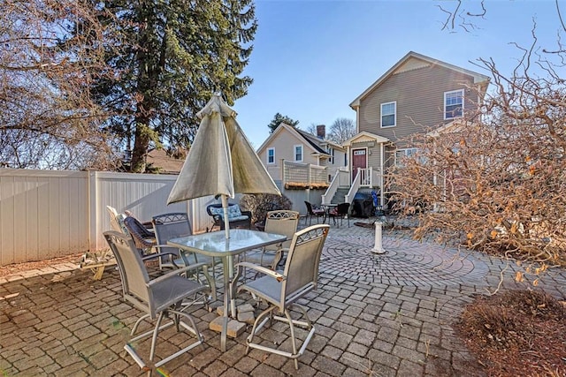 view of patio / terrace with outdoor dining space and fence